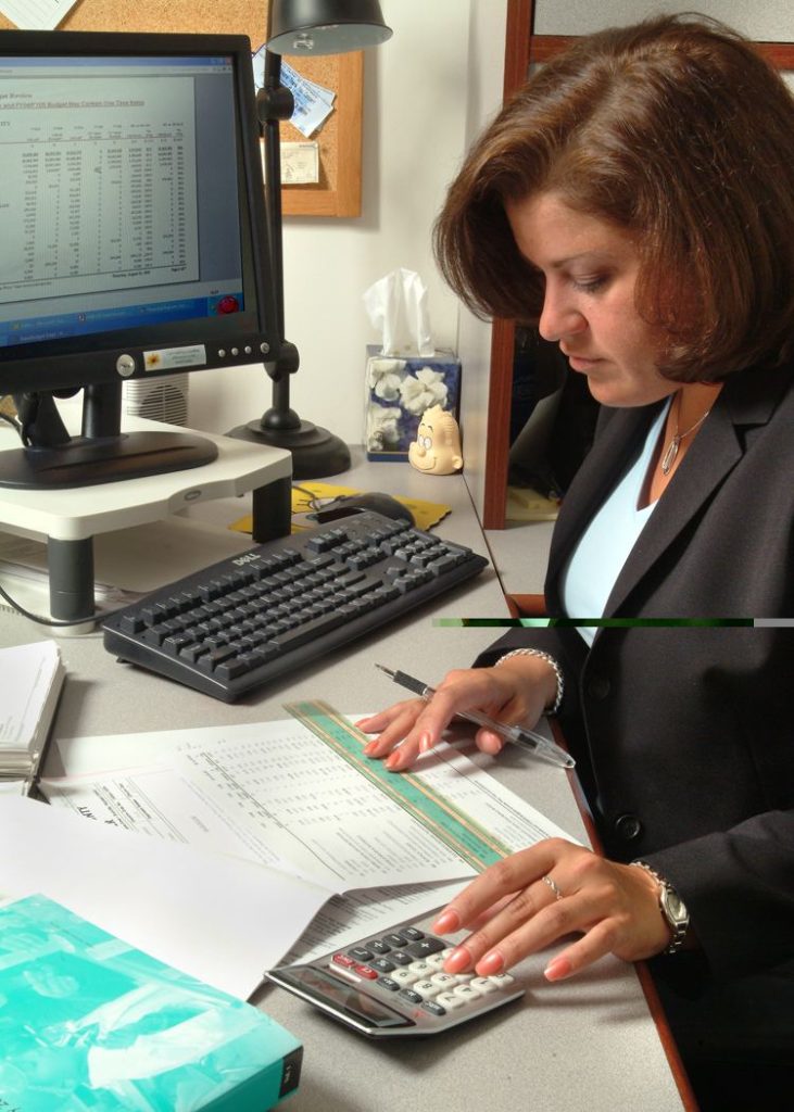 Auto-Escalation Lifts Retirement Saving Without Opt-Outs A calculator and financial documents