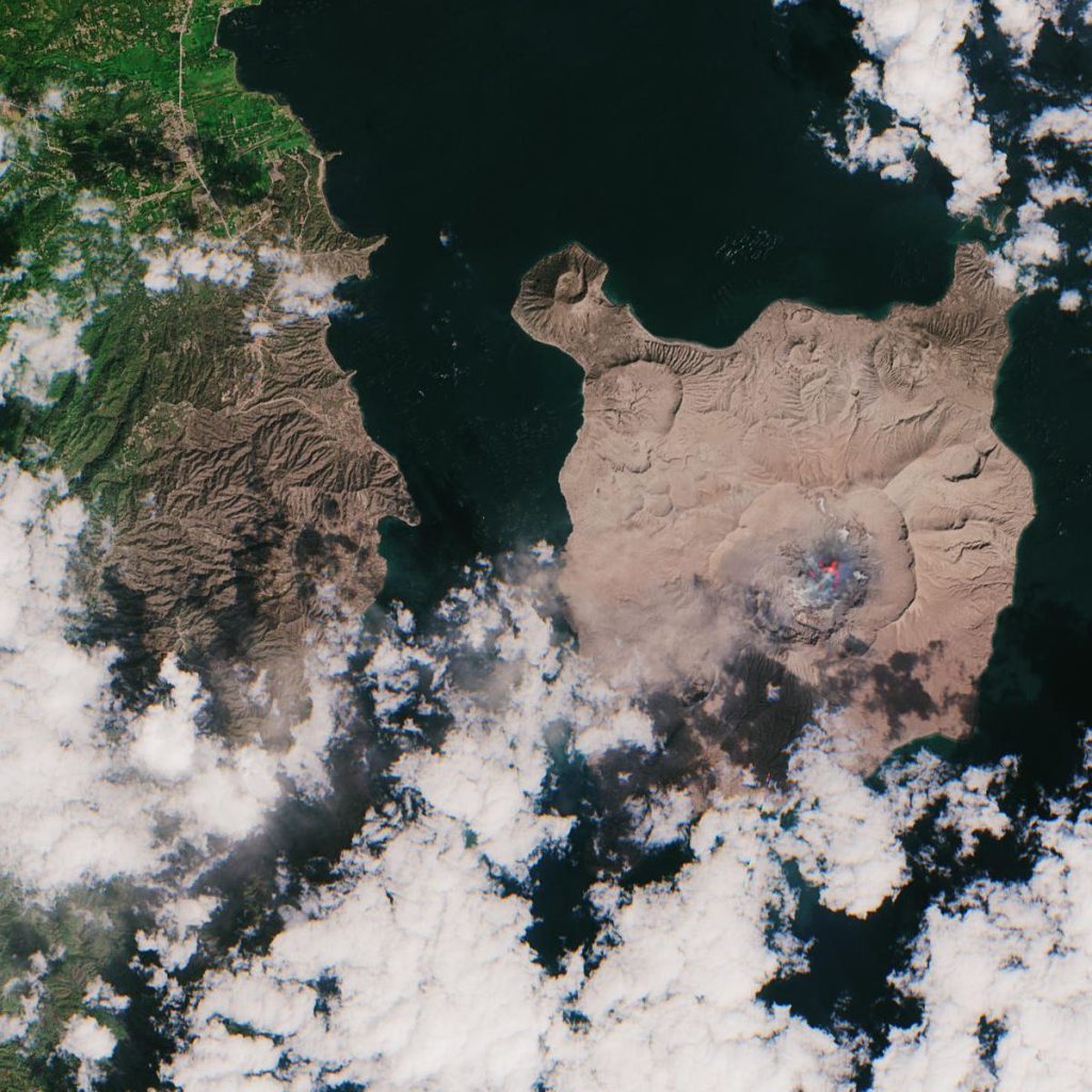 Volcanic Island Eruption Tracked by New Ash Monitoring Network volcanic ash cloud rising above an island